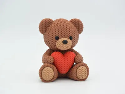 Knitted-style teddy bear figure with crochet texture