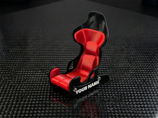 Racing seat shaped phone holder on a desk