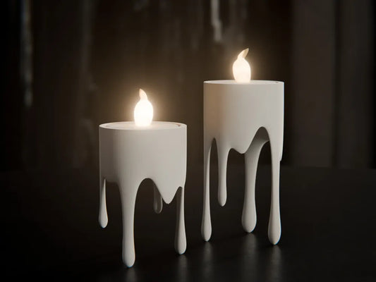 Pair of dripping candle holders with melting wax effect