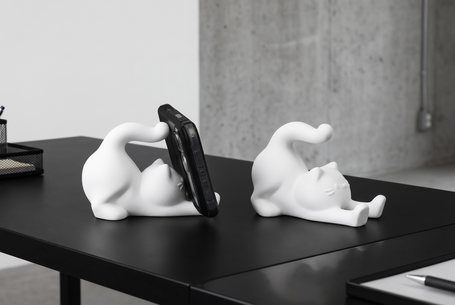 Cute stretching cat phone stand holding a phone