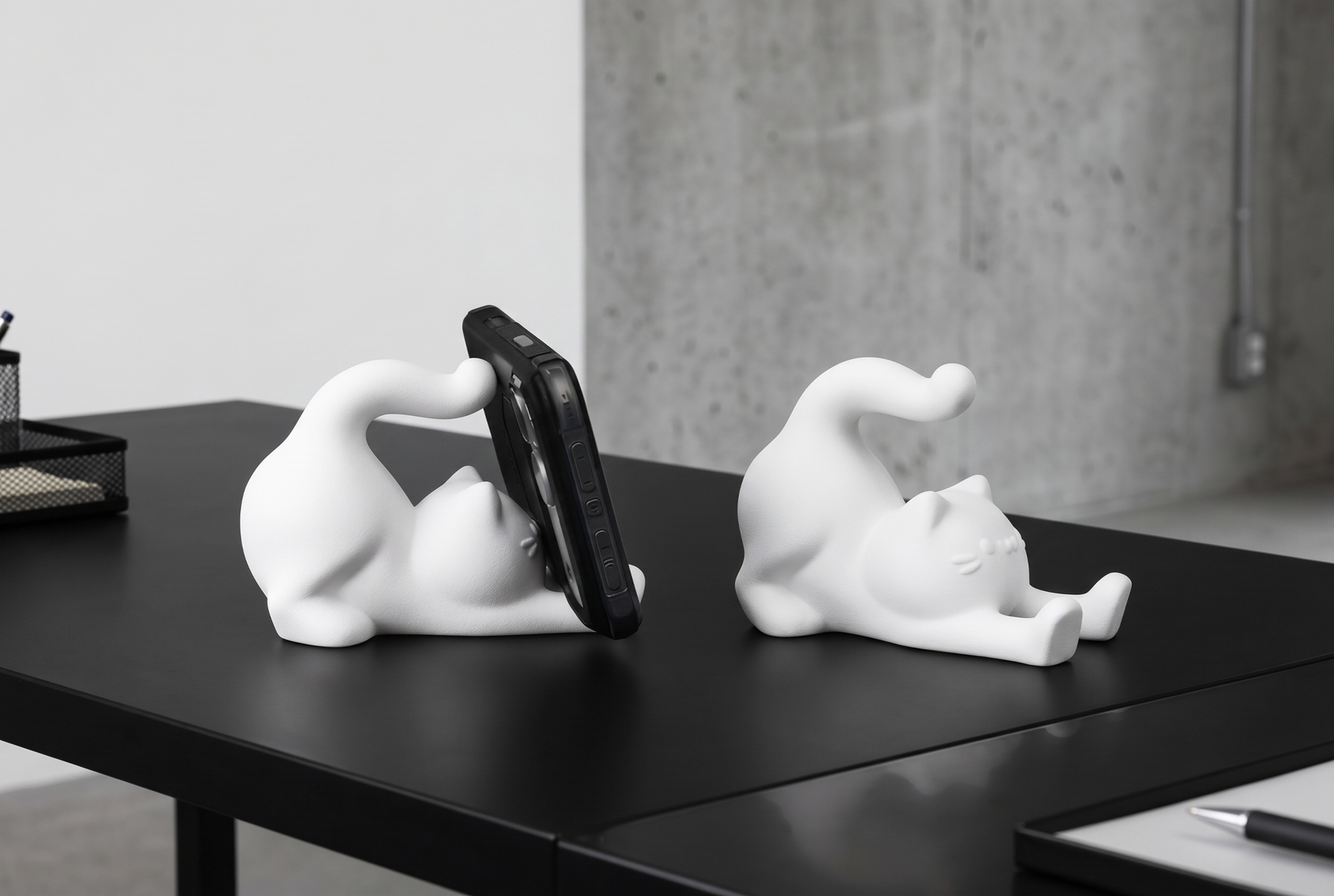 Cute stretching cat phone stand holding a phone