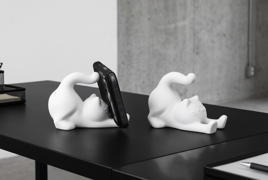 Cute stretching cat phone stand holding a phone