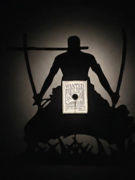 Shadow lamp casting a silhouette on a wall
